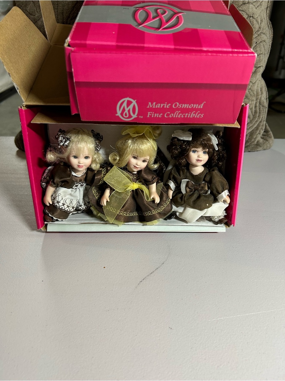 Charisma Porcelain Doll Trio in Brown, Cream & Yellow Accents